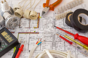 Still Life Of Electrical Components Arranged On Plans.